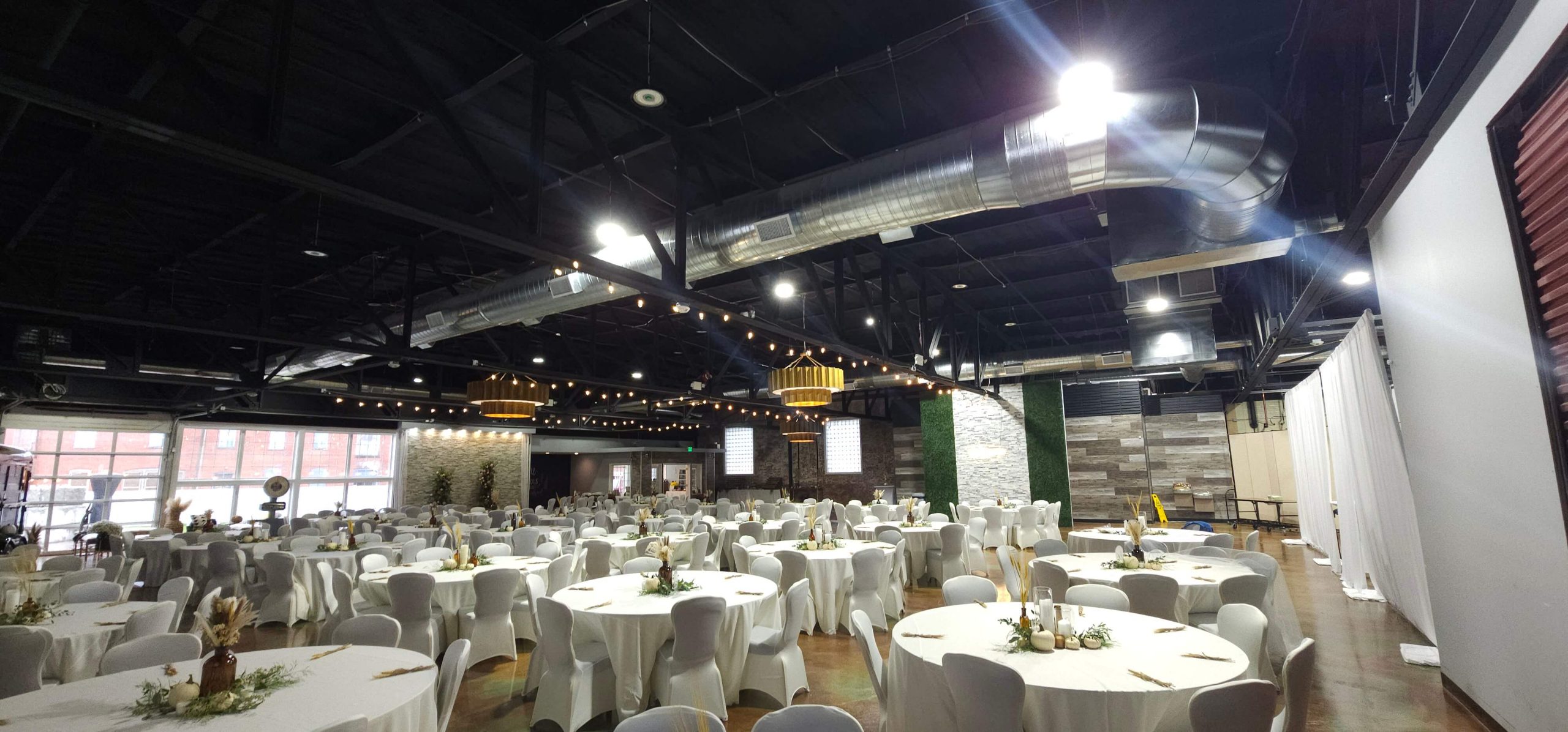 floorspace full of clean white dining tables ready for guests