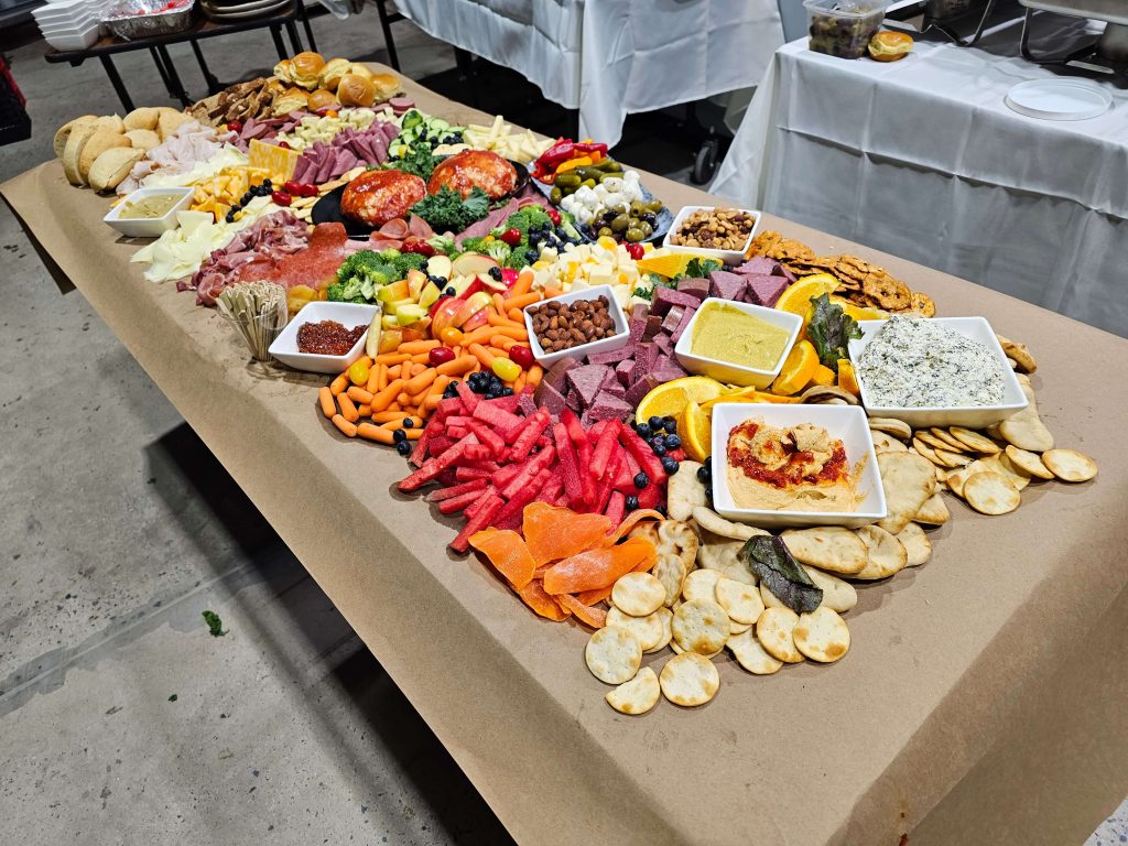 table brimming with hors d'oeuvres, on-site catering